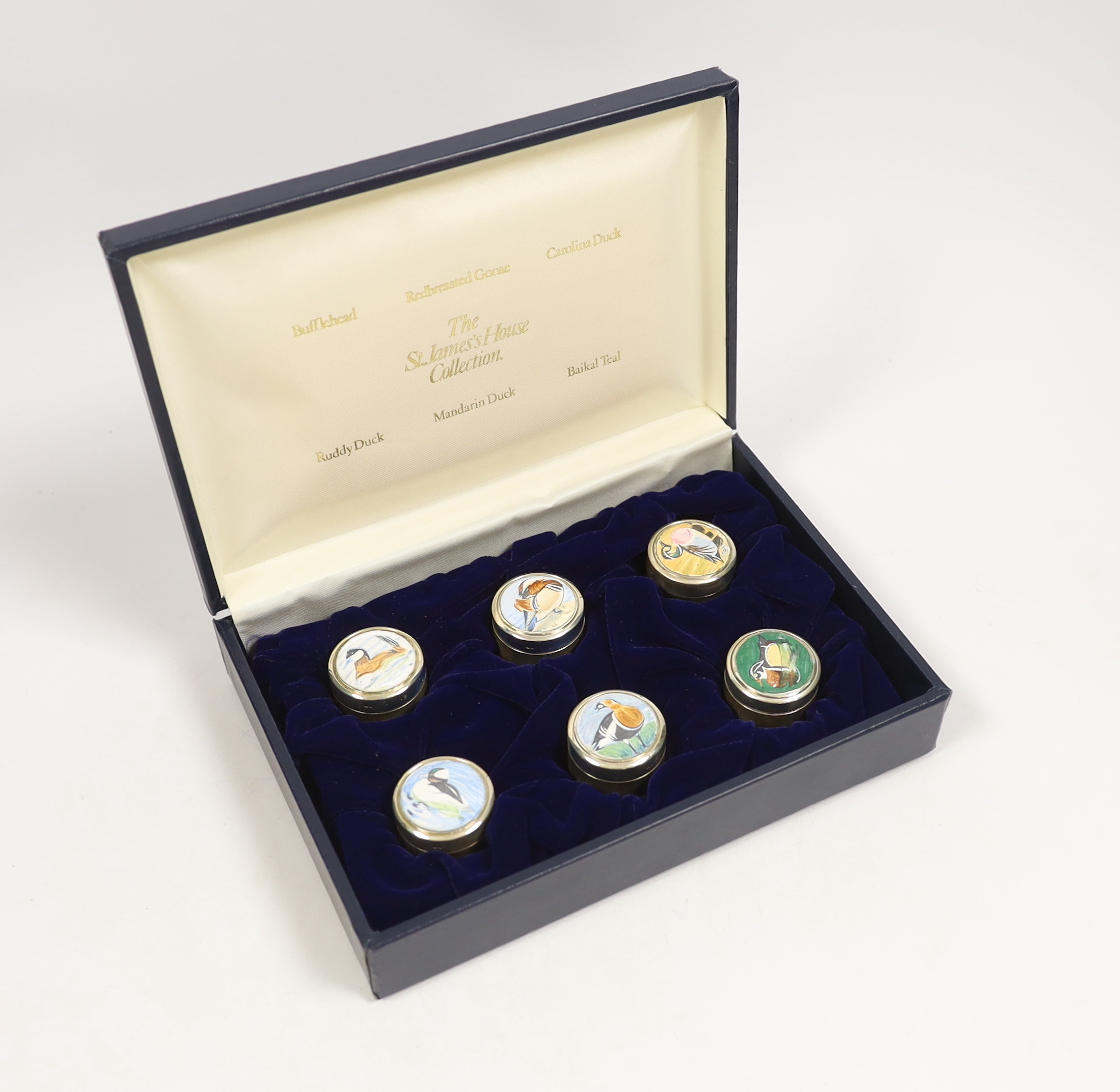 A cased set of six Elizabeth II St James's House Collection silver and enamel wild bird pill boxes, diameter 32mm, with certificate.